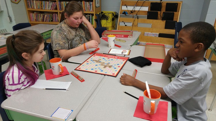 Returnee member Shashawna shows Sienna to her right and Oddo how to play