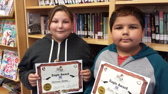 Shashawna Tremblay and Braden Campbell proudly show off their Eagle Certificates for 100% Attendance which they received during the Highest Overall Attendance in the Division Celebration held at the school on September 3/25